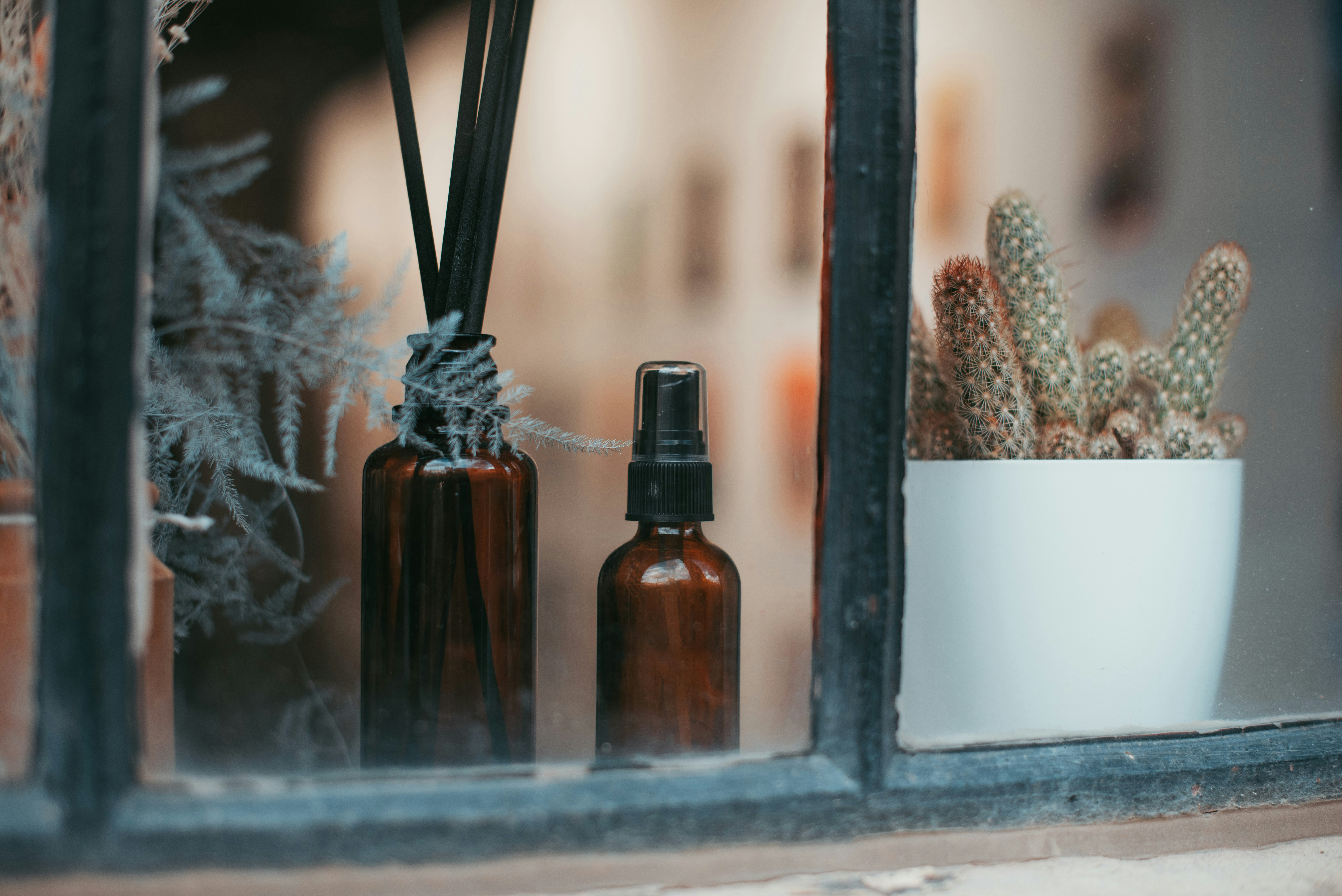 brown glass bottles on gray wooden table